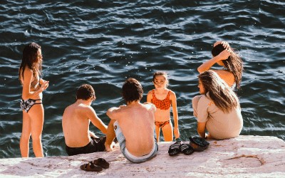 a group of children playing lakeside