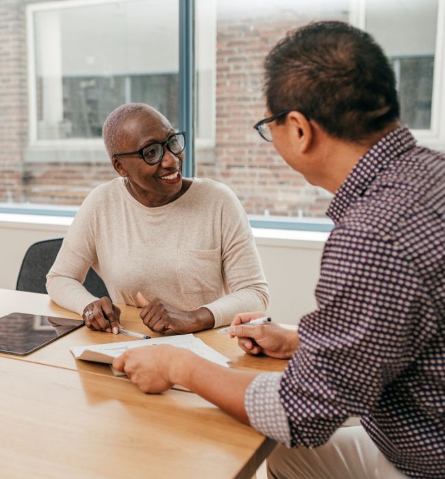 two people signing their power of attorney documents